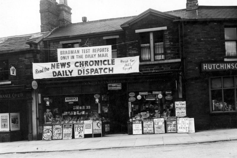 Newsagents A.C. Rhodes on St Michael's Road in June 1956. On the left is the Prudential Assurance Co. Ltd., and on the right is Hutchinsons, garage proprietors.