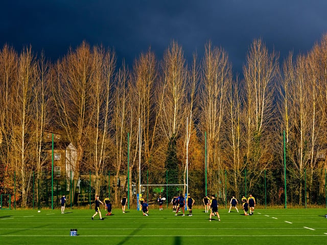 Rhinos train under darkening skies at their Kirkstall base.