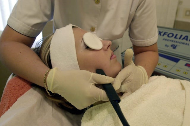 Beauty therapist Keeley Hidle Gibson works with a exfoliance machine at her salon in Morley in July 2002.