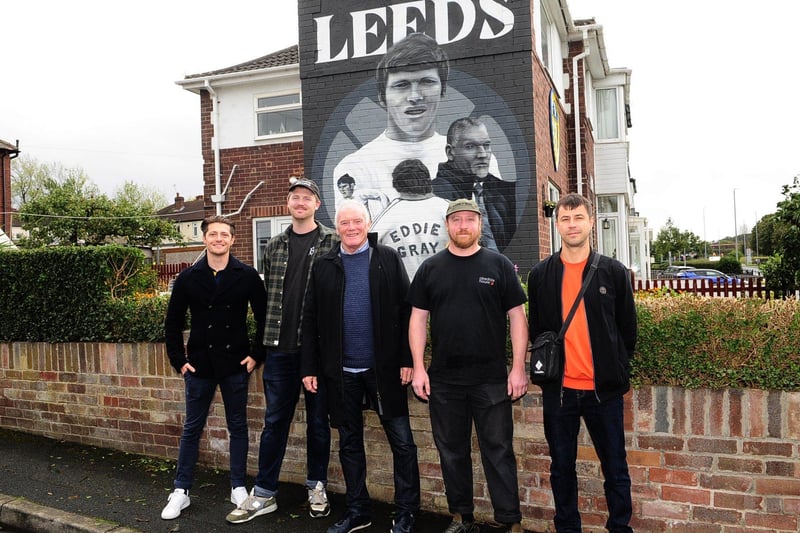 The mural is located on Elland Road, just opposite the ground, and is painted on an 81-year-old's house. Pictured is Eddie Gray, with designer Rhys Lowry and artists Lune Nunn, Adam Duffield and Jamie Steward.