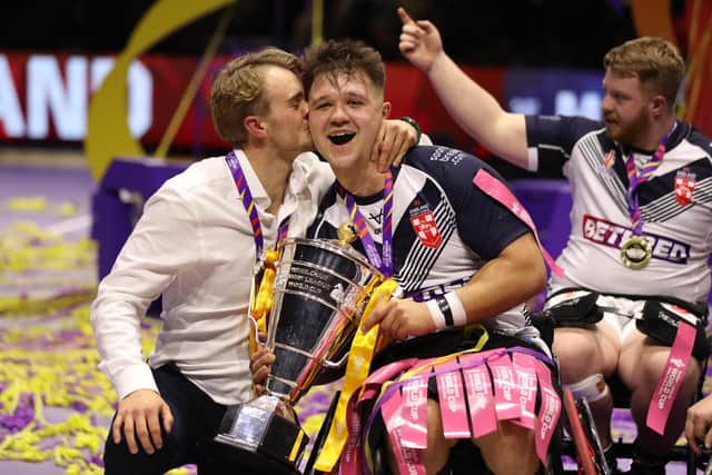 England coach Tom Coyd and captain Tom Halliwell celebrate with the Wheelchair World Cup Trophy. Picture by Charlotte Tattersall/Getty Images for RLWC.