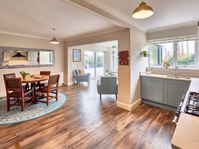 The open plan family kitchen has clear zones for cooking, dining and relaxing, accumulating into a wonderfully social space.