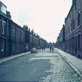 Terraced houses on Ganton Mount in Woodhouse in June 1975. The street continues as Glossop Street further along before reaching the junction with Christopher Road in the background, with Cross Quarry Street leading off from this.