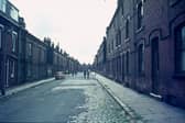 Terraced houses on Ganton Mount in Woodhouse in June 1975. The street continues as Glossop Street further along before reaching the junction with Christopher Road in the background, with Cross Quarry Street leading off from this.