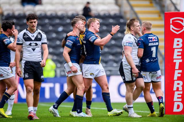James McDonnell is congratulated on his try against Hull FC, but Leeds Rhinos didn't have much else to celebrate. Picture by Allan McKenzie/SWpix.com.