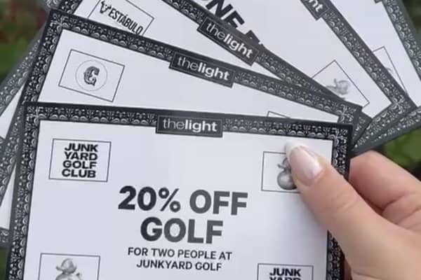 The Light MONOPOLY vouchers in hand outside The Light centre, Leeds
