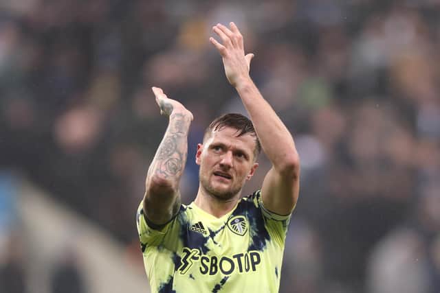 NEWCASTLE UPON TYNE, ENGLAND - DECEMBER 31: Liam Cooper of Leeds United applauds the fans following the Premier League match between Newcastle United and Leeds United at St. James Park on December 31, 2022 in Newcastle upon Tyne, England. (Photo by George Wood/Getty Images)