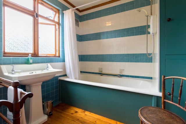 The family bathroom is a two-piece-suite with a shower over the bath, a wash hand basin and a separate toilet, which is practical for busy households in the morning rush.