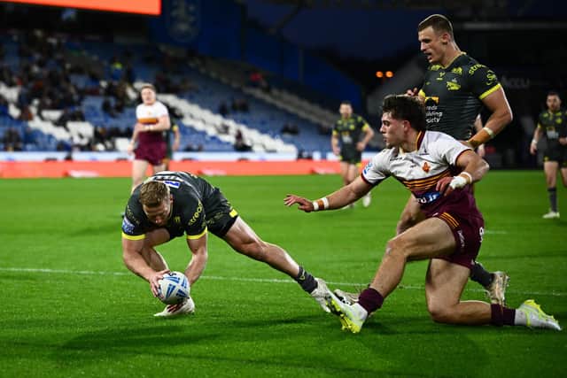 Lachie Miller touches down for one of Leeds Rhinos' 10 tries in last week's win at Huddersfield Giants.Picture by Olly Hassell/SWpix.com.