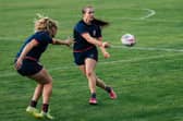 Leeds Rhinos' Evie Cousins, right, seen training with England last year. Picture by Alex Whitehead/SWpix.com.