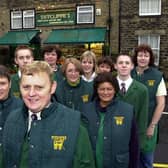 Sutcliffe's greengrocers was celebrating 100 years in November 2000. Pictured is Raymond Sutcliffe with his staff outside the shop on Town Street.