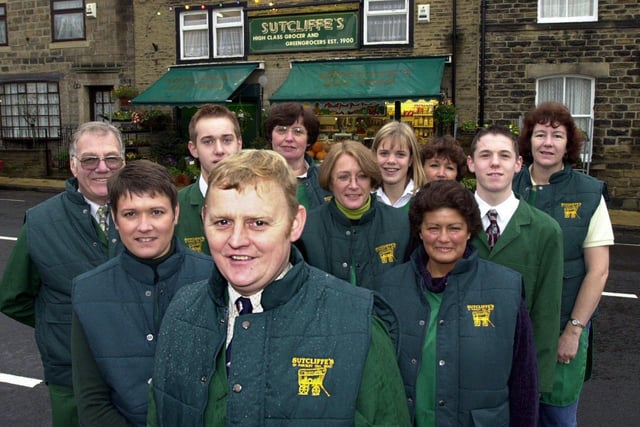 Sutcliffe's greengrocers was celebrating 100 years in November 2000. Pictured is Raymond Sutcliffe with his staff outside the shop on Town Street.