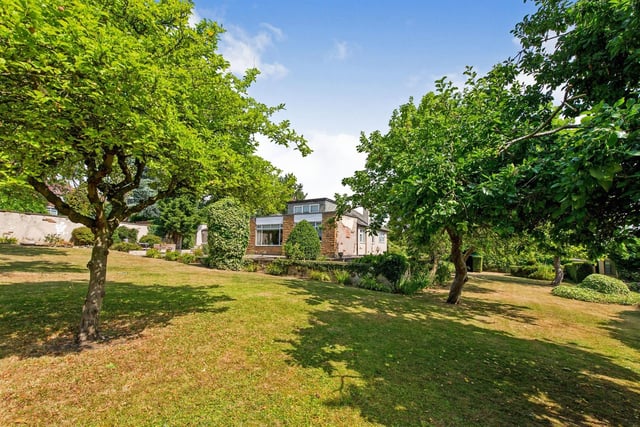 The attractive grounds extend around the property