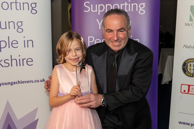 Eden Smith, eight, of Holmfirth, won the Youngster of the Year award, sponsored by Nabarro McAllister. Eden began to suffer pains in her legs and was feeling cold all the time when she was six. A visit to her local hospital saw her rushed into the LGI where she was rapidly diagnosed as having neuroblastoma and a large tumour was found in her stomach. She immediately began 80 days of chemotherapy and had a bone marrow transplant. It took nine hours to remove the tumour. Despite the chemotherapy, doctors were not entirely happy with her progress so she then moved on to another lengthy round of high-dose chemo, including 30 days where she had to be completely isolated, her stem cells were harvested and she then went through ten rounds of radiotherapy. Since then she has been part of a clinical trial of a vaccine in New York, making four trips to the US so far, with another due another next month. This has been possible through a marathon fundraising effort by our winner herself, her family and the community in Holmfirth, raising more than £500,000. Her own efforts, while still in the throes of treatment, included planning to walk four miles of a sponsored walk but she actually completed 14. And her hometown turned pink to mark her birthday with a host of fundraising initiatives throughout the community.