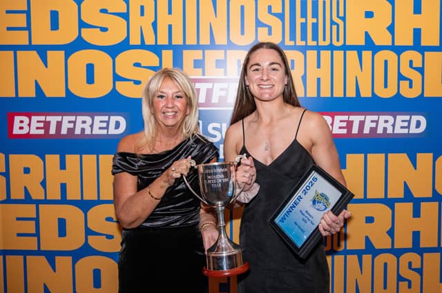 Mel Howard, right, receives the women's player of the year trophy from Leeds Rhinos president Gill Spencer. Picture by Tom Pearson/Leeds Rhinos.