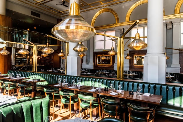 The restaurant's olive-green leather banquettes were created using 160 premium leather hides.