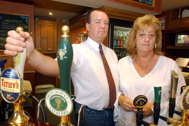 John and Lorraine Mitchell, who run the Town Hall Tavern pub, in Leeds city centre, pictured at the bar in August, 2003.