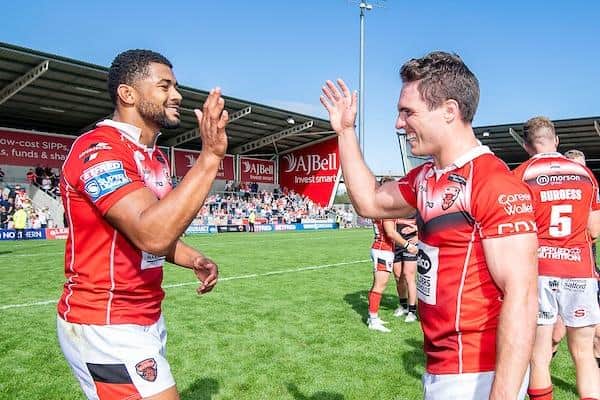 Kallum Watkins, left and Brodie Croft celebrate Salford's win over St Helens in July, 2022. They will be on rival teams when Betfred Super League kicks off this week. Picture by Allan McKenzie/SWpix.com.