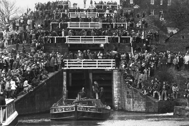 Like football fans on the terraces, thousands watch the barge Wye as she marked the 200th anniversary of a Yorkshire engineering feat in March 1974. It was the construction of the Five-Rise locks on the Leeds and Liverpool Canal at Bingley.