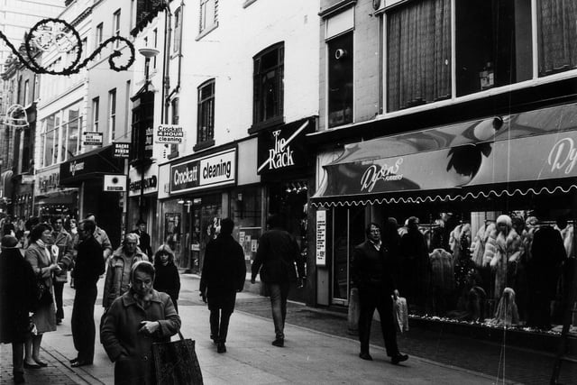 Christmas shoppers on Commercial Street circa 1983. Shops in focus include Crockatt Cleaning, Tie Rack ties and Dyson Furriers.