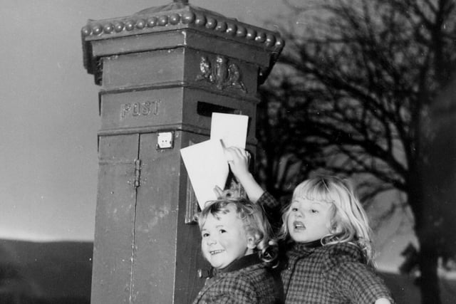 Did you post your Christmas cards and lists for Santa from this hexagonal post box on Denton Road in Ilkley back in the day? Pictured are young Alison Christie and sister Julie in December 1971.