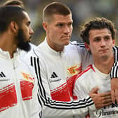 Players including including Union Berlin's German forward #17 Kevin Behrens (2nd L) and Union Berlin's US midfielder #07 Brenden Aaronson react after the German first division Bundesliga football match between Borussia Dortmund and 1 FC Union Berlin in Dortmund, western Germany on October 7, 2023 (Photo by INA FASSBENDER/AFP via Getty Images)