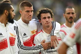 Players including including Union Berlin's German forward #17 Kevin Behrens (2nd L) and Union Berlin's US midfielder #07 Brenden Aaronson react after the German first division Bundesliga football match between Borussia Dortmund and 1 FC Union Berlin in Dortmund, western Germany on October 7, 2023 (Photo by INA FASSBENDER/AFP via Getty Images)