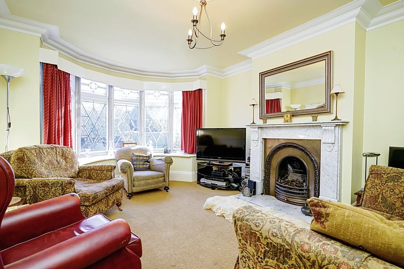 Downstairs, the property has an entrance into the vast hall space, leading further into two spacious reception rooms.