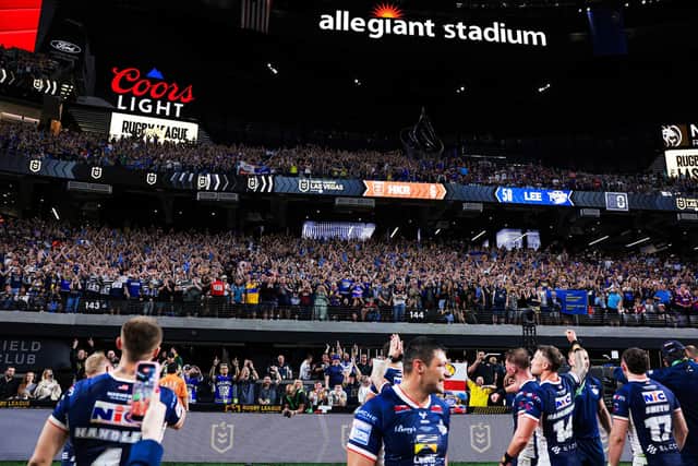 Leeds Rhinos players celebrate with their fans following the win against Hull KR at Allegiant Stadium in Las Vegas three months ago. Picture by Alex Whitehead/SWpix.com.