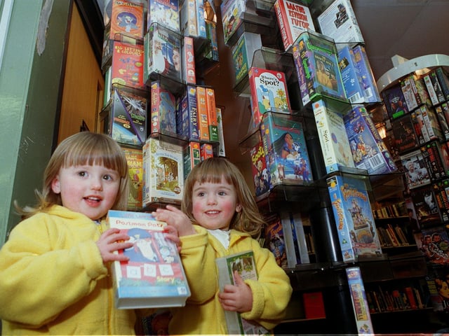 A new video library was launched at Holt Park Library in March 1999. Pictured are Emma and Lauren Taverner looking through what was on offer.