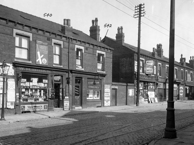 Shops along Compton Road in September 1935. Pictured, from left, are W H Binks, hairdresser and newsagents, Compton Fisheries, A Pullan, Confectioners, Ramsden, dental surgeon, and Beck's bakery. Poster for Shaftesbury cinema, which was showing 'Vagabond Lady', 'Masa Hiruwaka', and 'One Frightened Night'. R