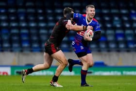 Hunslet's latest signing Myles Harrop, with ball, seen in Challenge Cup action for Rochdale Hornets against Widnes in January. Picture by Olly Hassell/SWpix.com.
