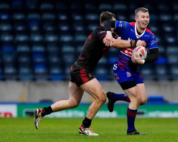 Hunslet's latest signing Myles Harrop, with ball, seen in Challenge Cup action for Rochdale Hornets against Widnes in January. Picture by Olly Hassell/SWpix.com.