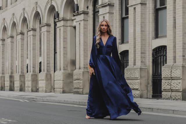 Sadie navy satin maxi dress , £375, from the Signature collection at RHOEN.