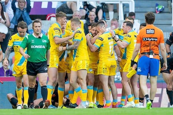 Rhinos celebrate Aidan Sezer's try against Castleford at this year's Magic Weekend. Picture by Allan McKenzie/SWpix.com.