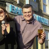 Victoria Beckham look-a-like Gill Penny is pictured with landlord Jim Meecham at the Barley Mow pub on Town Street in November 2002.
