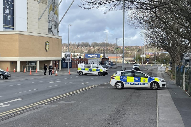 There are police vehicles parked outside the Jack Charlton East Stand.