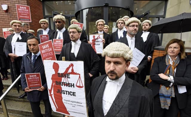 Barristers outside Leeds Crown Court during a recent strike day. They have started an indefinite strike this morning, meaning they will not go back to work until the issue is resolved. Picture: Asadour Guzelian