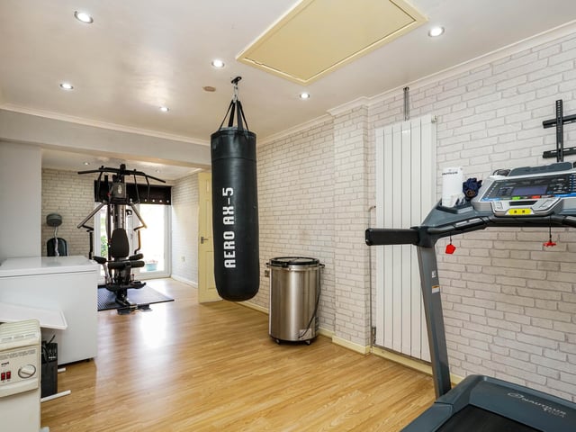 Additionally, the garage has been converted into a home gym large enough for a multigym, treadmill and more.