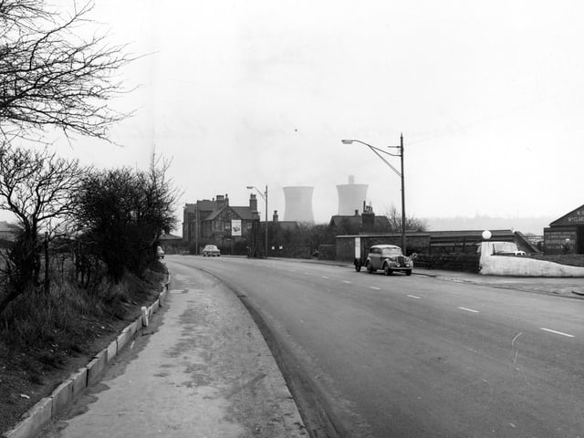 Commercial Road showing Kirkstall Gas Holding Station and W. Clarkeson and Sons motor engineers. Cooling towers at Kirkstall Power Station can be seen. Pictured in January 1956.
