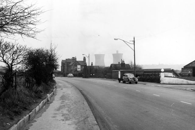 Commercial Road showing Kirkstall Gas Holding Station and W. Clarkeson and Sons motor engineers. Cooling towers at Kirkstall Power Station can be seen. Pictured in January 1956.