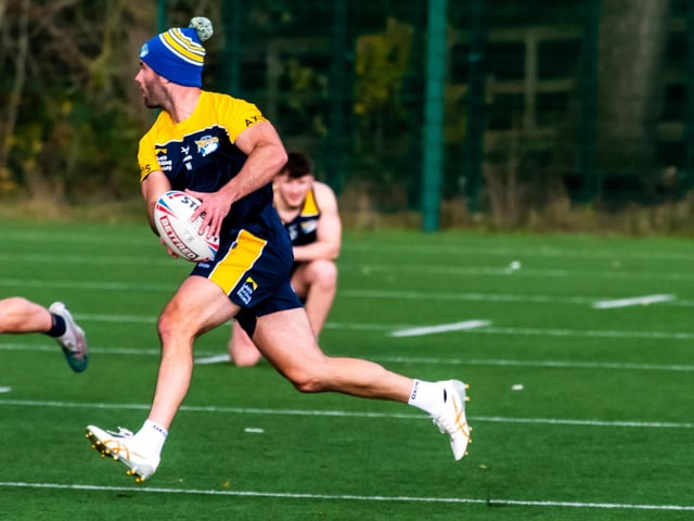 Rhinos' new Australian half-back Matt Frawley runs with the ball at his first training session.