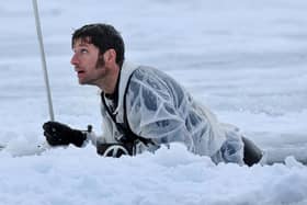 Guy Martin climbing out of a pit of ice cold water. He featured in a new series called Guy Martin: Arctic Warrior on Channel 4 (Picture: Royal Navy/Channel 4)
