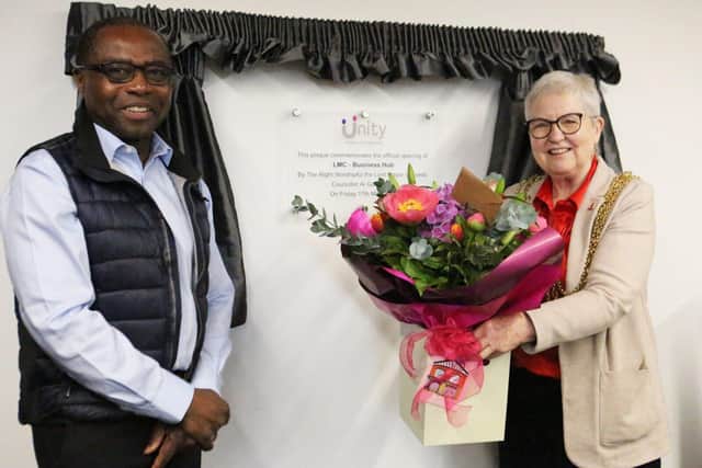 Unity Homes and Enterprise Chief Executive Cedric Boston makes a presentation to the Lord Mayor o