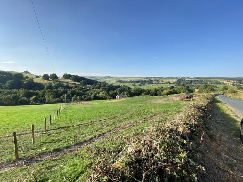 This lot is the lower field at Spout Lane, opposite White Acres Farm, Stannington. It has a guide price of £45,000 and is described as freehold grazing land amounting to 1.44 acres with stables, new gated entrance and fencing.