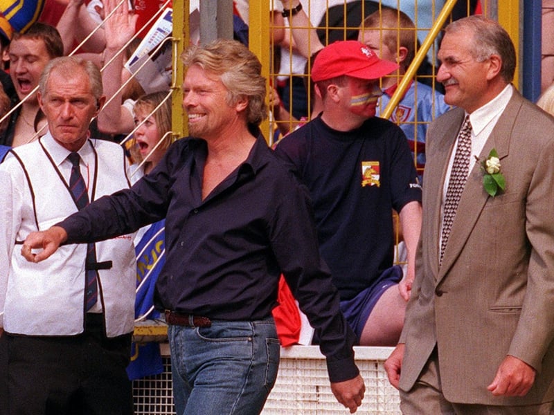 Leeds Rhinos chairman Paul Caddick, right, alongside Richard Branson who was Broncos' owner at the time.