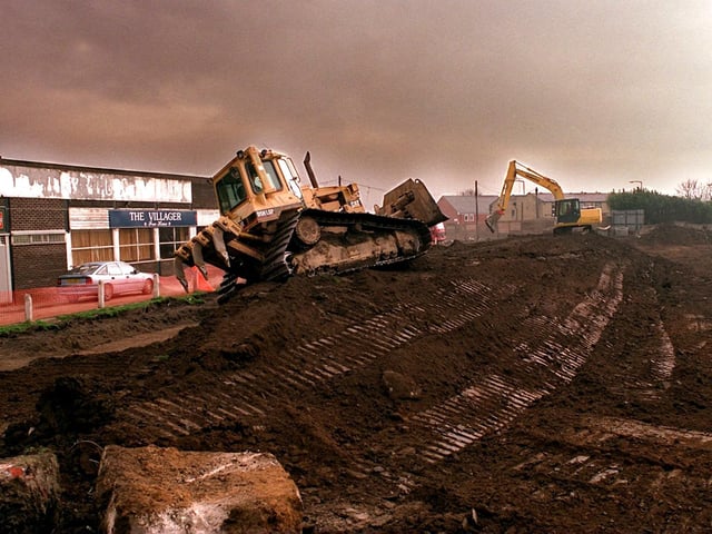 Diggers rip up the pitch  of the former Bramley Rugby League Club in March 1997.