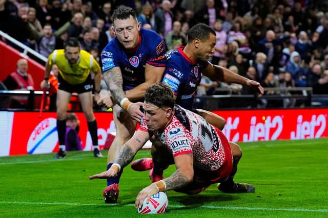 Keanan Brand scores for Leigh Leopards in their win against St Helens which sealed Leeds Rhinos' top-four finish in Betfred Super League. Picture by Olly Hassell/SWpix.com.
