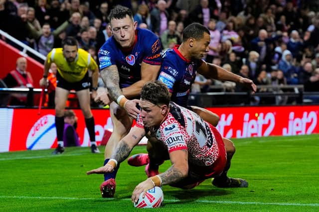 Keanan Brand scores for Leigh Leopards in their win against St Helens which sealed Leeds Rhinos' top-four finish in Betfred Super League. Picture by Olly Hassell/SWpix.com.