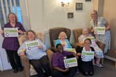 Colleagues and residents at Simon Marks Court celebrate the care home's good CQC rating